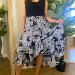 Black and white printed flowing midi skirt with subtle slit